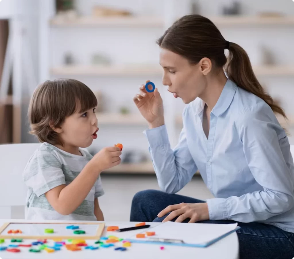 ABA therapist working one-on-one with a young child during a session