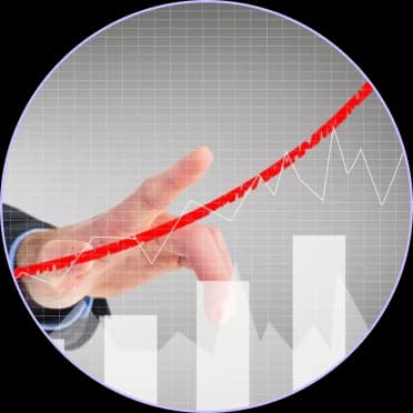 Finger tracing a rising red revenue line over a bar chart