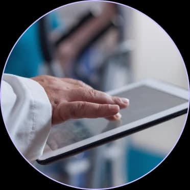 Hand tapping a tablet screen