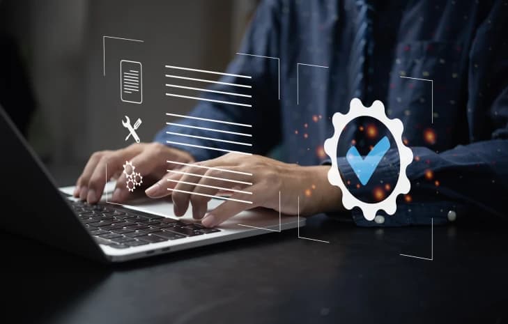 Person typing on a laptop with coding and compliance icons overlaid