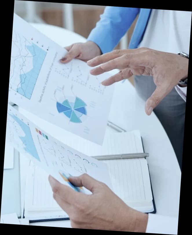 Two colleagues reviewing orthopedic billing charts and reports