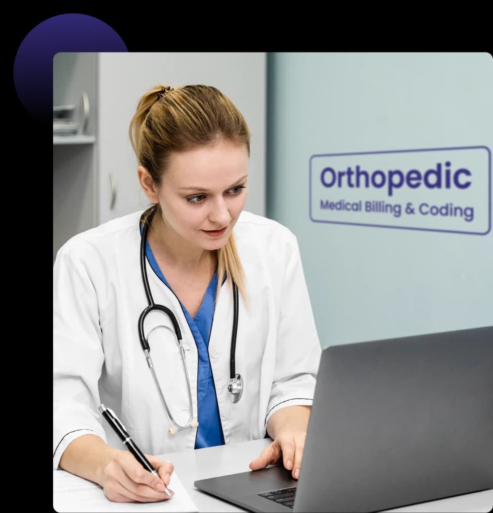Orthopedic physician reviewing billing and coding on a laptop