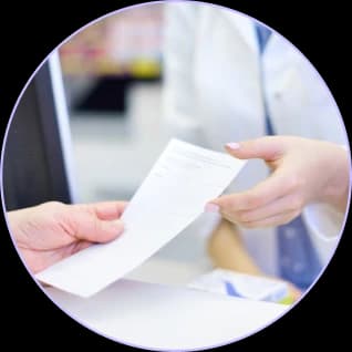 Clinician handing a paper claim across a front desk counter