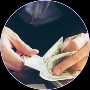 Hands counting cash payments