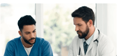 Person confirming insurance benefits with a checkmark over a laptop