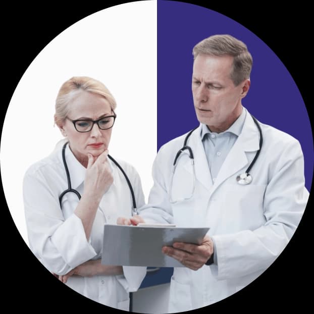 Dedicated account manager and certified medical biller reviewing a chart