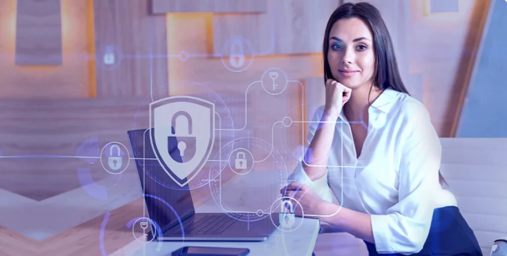 Coder at a laptop protected by data security shield icons
