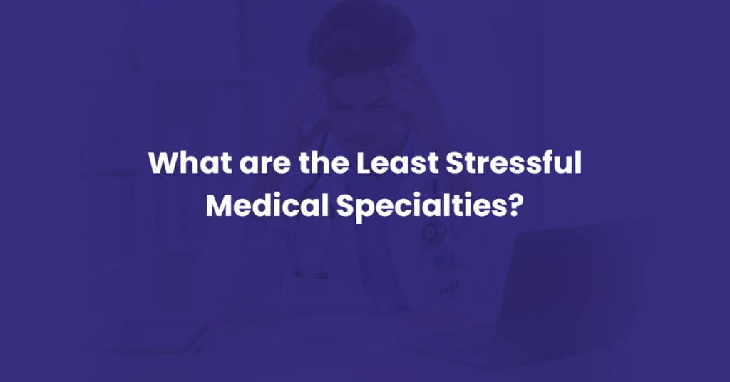 Physician with head in hands at a laptop, illustrating medical specialty burnout